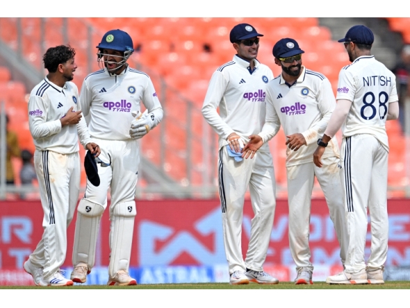 India's players celebrate their win in the first Test cricket match against West Indies at the Narendra Modi Stadium in Ahmedabad on October 4, 2025. (Photo by R.Satish Babu / AFP) 