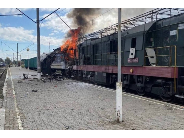 This handout photograph, taken and released by the press service of Ukrainian Railways on October 4, 2025, shows a burning train carriage following a drone attack in Shostka, Sumy region, amid the Russian invasion of Ukraine.(Photo by Handout / UKRAINIAN RAILWAYS / AFP) 