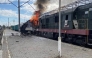 This handout photograph, taken and released by the press service of Ukrainian Railways on October 4, 2025, shows a burning train carriage following a drone attack in Shostka, Sumy region, amid the Russian invasion of Ukraine.(Photo by Handout / UKRAINIAN RAILWAYS / AFP) 