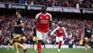 Arsenal's English midfielder #07 Bukayo Saka celebrates after scoring their second goal from the penalty spot during the English Premier League football match between Arsenal and West Ham United at the Emirates Stadium in London on October 4, 2025. (Photo by HENRY NICHOLLS / AFP)