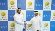 Chief Executive Officer of Al Meera Jassim Al Ansari (left) and Founder and CEO of Kafy, Khalifa Al-Sada, at the MoU signing.  