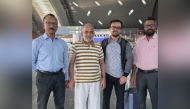 The elderly passenger with his son-in-law (second from right) along with Indian officials from Qatar 