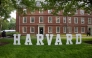 A Harvard sign is seen at the Harvard University campus in Boston, Massachusetts, on May 27, 2025. (Photo by Rick Friedman / AFP)
