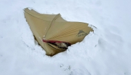 This handout received on October 6 shows a tent buried under deep snow in the Karma Valley of the Tibet Autonomous Region on October 5, 2025. (Photo by Handout / Courtesy of Xiong JinXin / AFP) 