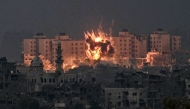 (Files) A fireball erupts during Israeli bombardment in the northern Gaza Strip on October 14, 2023. (Photo by Aris Messinis / AFP)