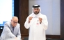 An official picks a team during the official draw ceremony.