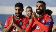 Egypt's forward #20 Ibrahim Adel celebrates with forward #10 Mohamed Salah after scoring his team's first goal during the FIFA World Cup 2026 Africa qualifier football match between Djibouti and Egypt at the Larbi Zaouli Stadium in Casablanca on October 8, 2025. (Photo by Abdel Majid BZIOUAT / AFP)