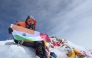 Safrina Latheef holding India and Qatar flags atop Mount Everest on May 18, 2025.