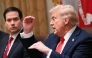 US President Donald Trump speaks, as Secretary of State Marco Rubio looks on, during a cabinet meeting in the Cabinet Room of the White House in Washington, DC, on October 9, 2025. (Photo by Jim Watson / AFP)