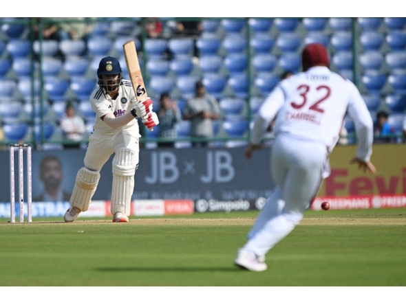 India's KL Rahul (L) reacts after playing a shot during the first day of the second and last Test cricket match between India and West Indies at the Arun Jaitley Stadium in New Delhi on October 10, 2025. (Photo by Sajjad Hussain / AFP)