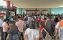 People gather outside a mall in Butuan City, on the southern island of Mindanao on October 10, 2025, after a 7.4-magnitude earthquake struck off the southern Philippines. (Photo by Erwin MASCARINAS / AFP)