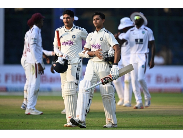India's Yashasvi Jaiswal (R) and captain Shubman Gill walk back to the pavilion at the end of the first day's play in New Delhi on October 10, 2025. (Photo by Sajjad Hussain / AFP) 