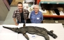 This undated handout image received in London from The University of Manchester on October 10, 2025 shows, Dr Dean Lomax (L) and Professor Judy Massare (R) posing beside the skeleton of the newly named sword dragon ichthyosaur, Xiphodracon goldencapensis, at the Royal Ontario Museum, Toronto, Canada. (Photo by University of Manchester / AFP)