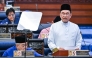 This handout photo taken and released by Malaysia's Department of Information on October 10, 2025 shows Malaysia's Prime Minister and Finance Minister Anwar Ibrahim delivering his speech on the 2026 national budget at the Parliament in Kuala Lumpur. (Photo by Nazri RAPAAI / DEPARTMENT OF INFORMATION / AFP