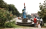 Vehicles pass in front of the statue of a lady holding a torch, in front of the party headquarters of the Cameroon People's Democratic Movement of incumbent Cameroonian President Paul Biya, in Yaounde, on October 10, 2025. (Photo by Daniel Beloumou Olomo / AFP)