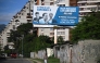 A billboard accusing opposition leaders (L-R) Leopoldo Lopez, Maria Corina Machado and Juan Guaido, for the US sanctions imposed on the country, is seen in Caracas on October 10, 2025, after Machado was awarded the Nobel Peace Prize. (Photo by Federico Parra / AFP)
