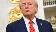 US President Donald Trump looks on during the announcement of a deal to lower drug prices with drug maker AstraZeneca at the Oval Office of the White House in Washington, DC, on October 10, 2025. (Photo by Saul Loeb / AFP)