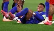 France's forward #10 Kylian Mbappe (C) reacts as he lies on the pitch during the FIFA World Cup 2026 Group D European qualification football, on October 10, 2025. (Photo by Anne-Christine POUJOULAT / AFP)