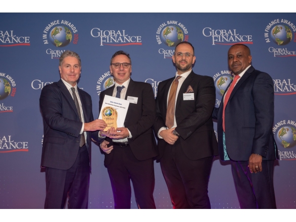 QIB’s Chief Strategy & Digital Officer, Dinos Constantinides receives the award from officials during the event. 