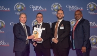 QIB’s Chief Strategy & Digital Officer, Dinos Constantinides receives the award from officials during the event. 