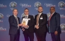 QIB’s Chief Strategy & Digital Officer, Dinos Constantinides receives the award from officials during the event. 