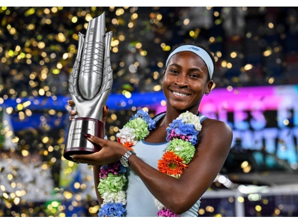 USA's Coco Gauff poses with her trophy after winning against USA's Jessica Pegula during an award ceremony for their women's singles at the Wuhan Open tennis tournament in Wuhan, Central China's Hubei province on October 12, 2025. (Photo by Adek Berry / AFP)