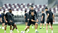 Qatar players take part in a training session. 