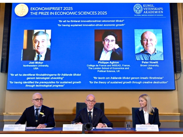 (L-R) John Hassler, Chair of the Committee for the Prize in Economic Science in Memory of Alfred Nobel, the Secretary General of the Royal Swedish Academy of Sciences Hans Ellegren and Kerstin Enflo, member of the Committee for the Prize in Economic Sciences in Memory of Alfred Nobel sit in front of a screen displaying the portraits of the 2025 prize winners. (Photo by Anders Wiklund / TT NEWS AGENCY / AFP) 