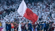 Qatari players celebrate after winning the FIFA World Cup 2026 Asian qualifier football match against the UAE at Jassim Bin Hamad Stadium in Doha yesterday. (AFP)