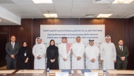 Senior Executive Vice President - Group Human Capital in QNB Group, Abdullah Nasser Al Khalifa, and Chairman of QACPA, Dr. Hashim Al-Sayed, with other officials during the signing of agreement.