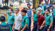 Police personnel escort detained army officers to the International Crimes Tribunal court in Dhaka on 22 October 2025. Photo by AFP