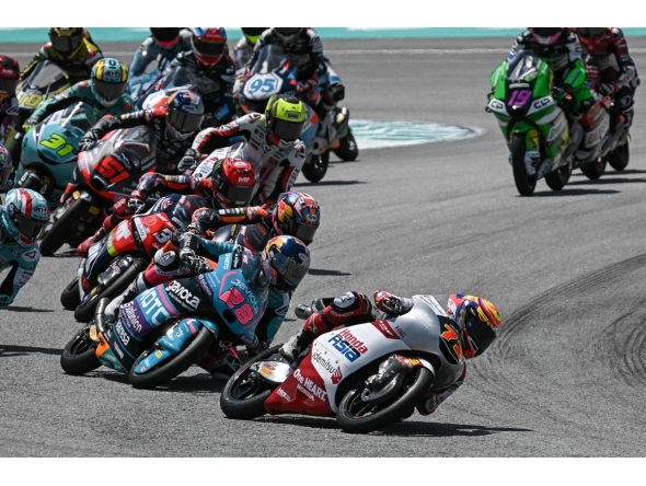 Riders compete in the Moto3 race at the MotoGP Malaysian Grand Prix at the Sepang International Circuit in Sepang on October 26, 2025. (Photo by Lillian SUWANRUMPHA / AFP)
