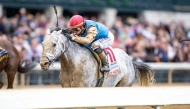 Jockey Irad Ortiz Jr, and Hit Show on their way to win the race.
