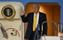 US President Donald Trump gestures as he prepares to alight from Air Force One upon arrival at Haneda Airport in Tokyo on October 27, 2025. (Photo by Philip Fong / AFP)
 