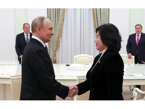 In this pool photograph distributed by the Russian state agency Sputnik, Russia's President Vladimir Putin meets with North Korean Foreign Minister Choe Son-hui in Moscow on October 27, 2025. (Photo by Vyacheslav PROKOFYEV / POOL / AFP)