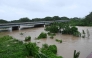 The Rio Cobre comes out of its banks near St. Catherine, Jamaica, on October 28, 2025. (Photo by Ricardo Makyn / AFP)
