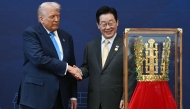 US President Donald Trump (L) shakes hands with South Korean President Lee Jae Myung during a high honor presentation ceremony at the Gyeongju National Museum in Gyeongju on October 29, 2025. (Photo by Andrew Caballero-Reynolds / AFP)