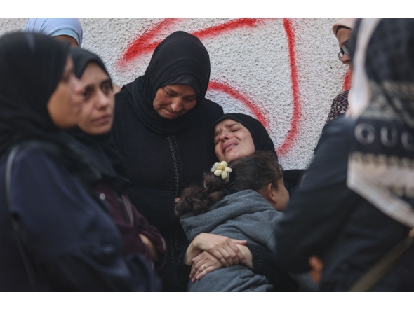 Palestinians mourn the death of loved ones killed in overnight Israeli strikes at the Al-Shifa Hospital in Gaza City on October 29, 2025. (Photo by Omar Al-Qattaa / AFP)
