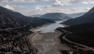 This aerial photograph shows the low water level of the Mornos artificial lake following a drought, near the village of Lidoriki, about 240 km northwest of Athens, on September 1, 2024. Photo by Angelos TZORTZINIS / AFP