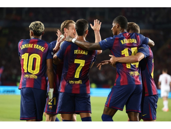 Barcelona's Spanish forward #07 Ferran Torres (C) celebrates with teammates after scoring their first goal during the UEFA Champions League league phase day 2 football match between FC Barcelona and Paris Saint-Germain (PSG) at the Estadi Olimpic Lluis Companys in Barcelona, on October 1, 2025. (Photo by Josep LAGO / AFP)