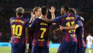 Barcelona's Spanish forward #07 Ferran Torres (C) celebrates with teammates after scoring their first goal during the UEFA Champions League league phase day 2 football match between FC Barcelona and Paris Saint-Germain (PSG) at the Estadi Olimpic Lluis Companys in Barcelona, on October 1, 2025. (Photo by Josep LAGO / AFP)