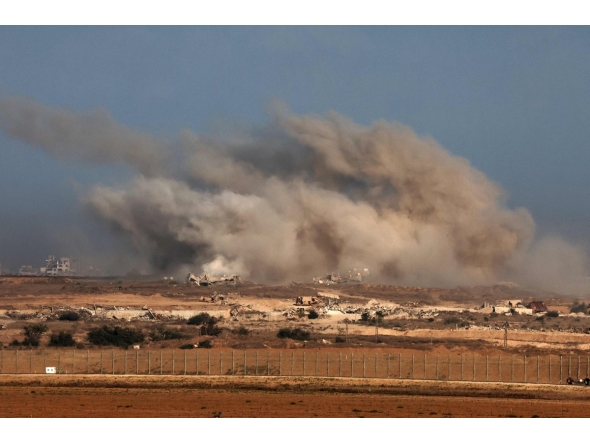 This picture taken from a position at Israel's border with the Gaza Strip shows smoke billowing during an Israeli strike on the besieged Palestinian territory on October 30, 2025. (Photo by Jack GUEZ / AFP)