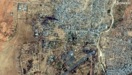 This handout satellite image by Vantor taken on October 26, 2025 and made available on October 31, 2025 shows smoke billowing from fires burning around El-Fasher Airport in El-Fasher. (Photo by Handout / Satellite image ｩ2025 Vantor / AFP)