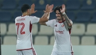 Al Shamal’s Alex Collado (right) celebrates with teammate Akram Tawfik Elhagrasi.