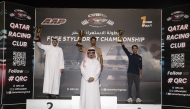 Qatar Racing Club's Director General Sheikh Jabor bin Khalid Al Thani poses for a photo with the podium winners.