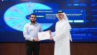 President of Kahramaa H E Eng. Abdulla bin Ali Al-Theyab presenting appreciation certificate to a participant.