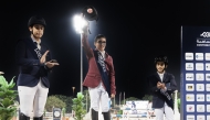 Young Riders Tour winner Khalifa bin Joaan bin Hamad Al Thani celebrates on the podium.