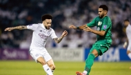 Al Sadd's Claudinho (left) vies for the ball with Al Ahli Saudi FC's Riyad Mahrez.