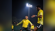 Al Gharafa's Yacine Brahimi (left) in action with a teammate. 