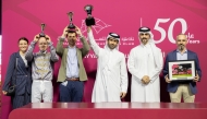 The connections of Al Wakrah celebrate with their trophies. PICS: Juhaim/QREC